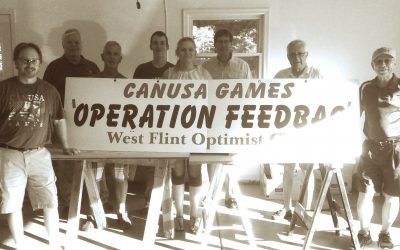 Members of West Flint Optimists Pack Lunches for CANUSA Kids
